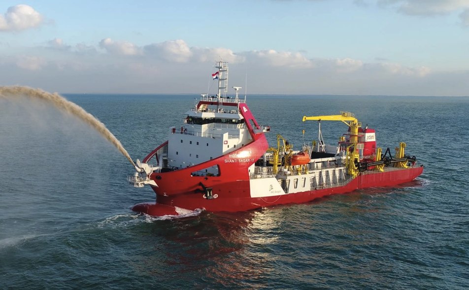 Trailing suction hopper dredger (TSHD) rainbowing sand